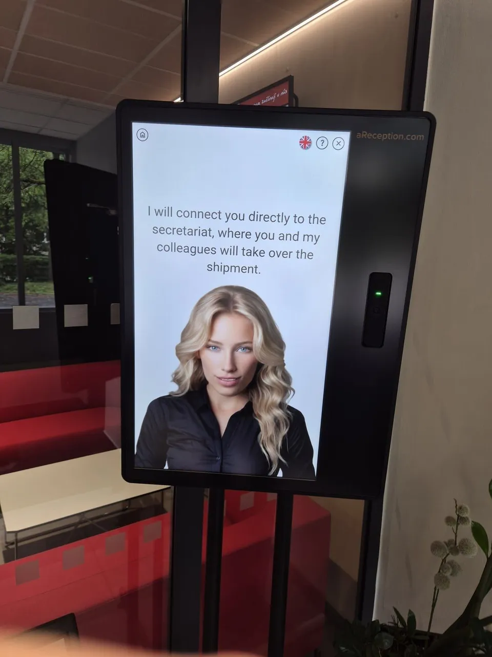 The aReception kiosk at ELVAC, its screen in English offering to connect a delivery to the secretariat