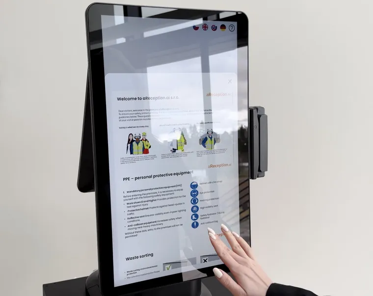 A visitor goes through the site induction on the aReception kiosk